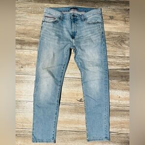 Tommy Jeans Scanton slim-fit denim jeans in a light blue wash.